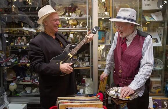 Kinks吉他手支持保存装饰艺术购物商场的电话